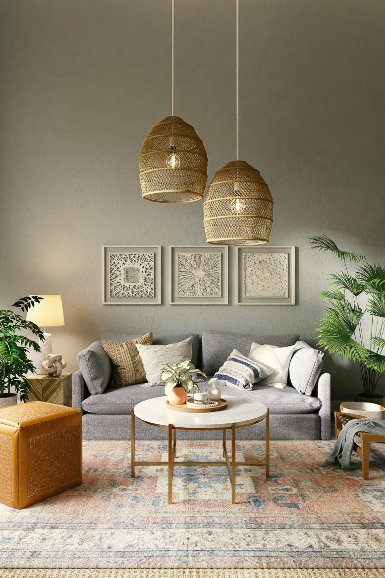 A living room with sofa, table and lights from the ceiling